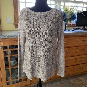 Cable knit sweater in taupe and cream knit.